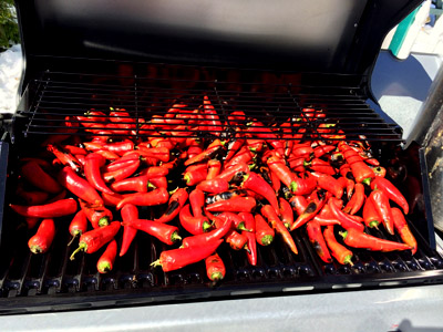 Red peppers cooking on the grill.